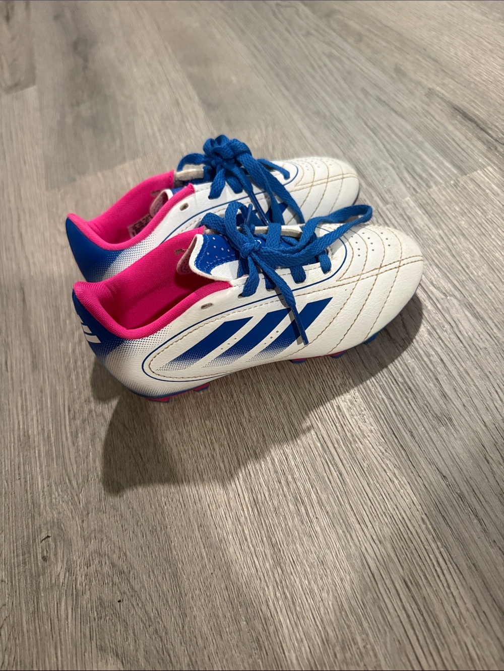 adidas Kids White Soccer Cleats with Blue Stripes and Pink Lining